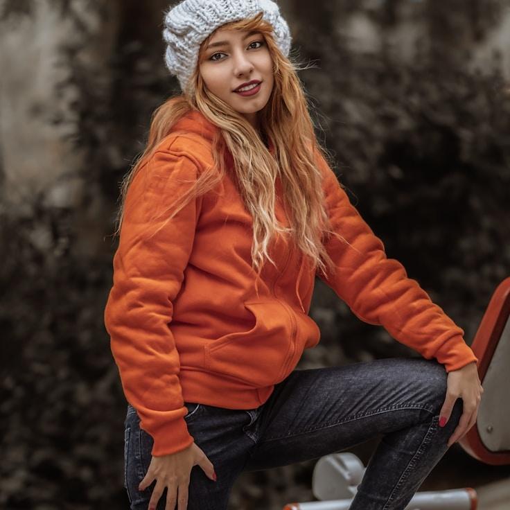 Avery Chen, Lead Design Curator at CitrusLeafGrove, reviewing corporate floral arrangements